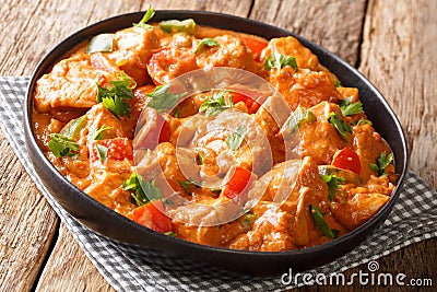 MafeÂ is a famous and popular West African dish cooked chicken in spicy peanut sauce close-up in a plate. horizontal Stock Photo